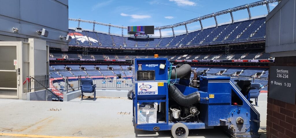 Blastrac shot blasting machine on the concourse slab at Empower Field at Mile High in Denver, Colorado
